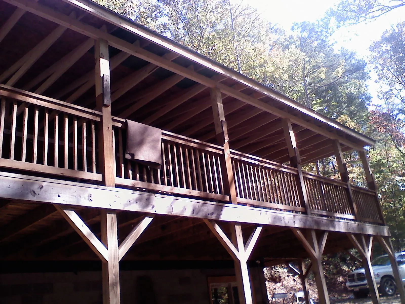 Timber framing under a new elevated porch and deck — Roof Leak Repair in Center Sandwich by Roofing Brothers